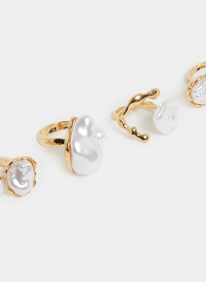 ستايلي طقم من 4 خواتم لؤلؤ صناعي